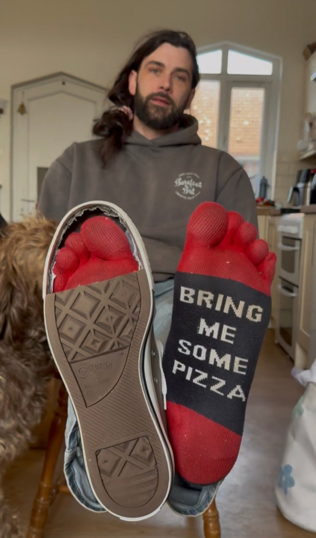 Man with toe socks on and a conventional shoe
