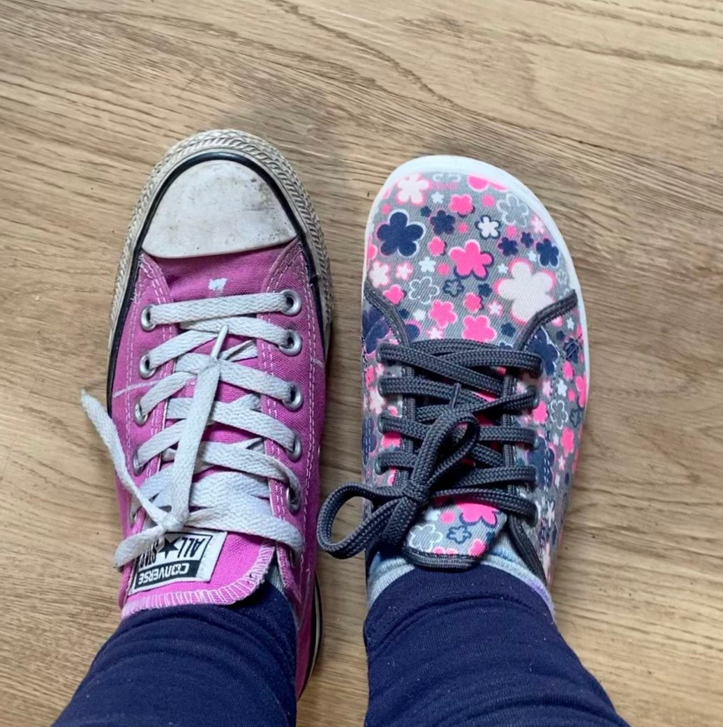 Side-by-side comparison of conventional trainers versus barefoot shoes showing toe box width