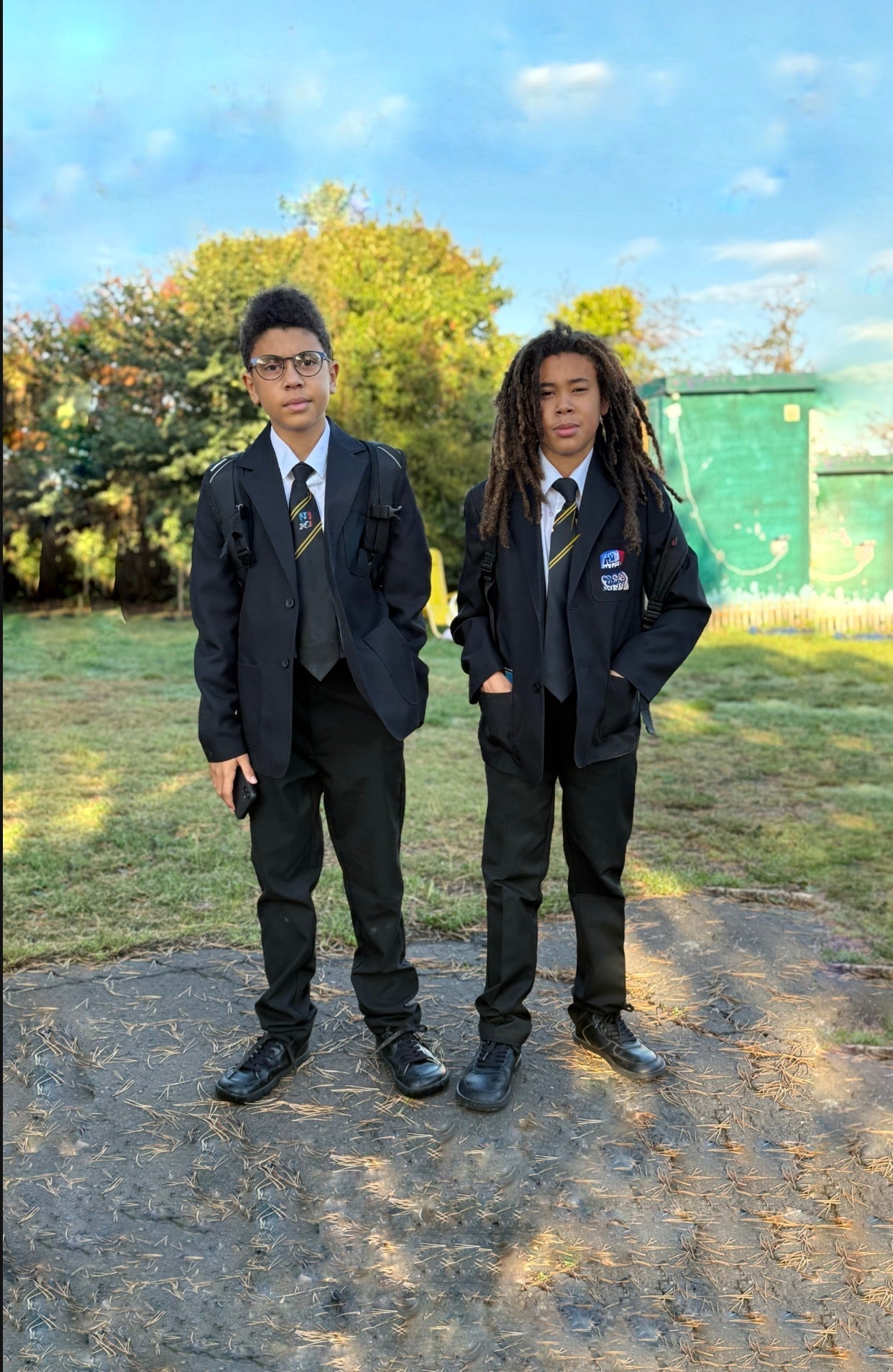 Two teenagers in school uniform wearing barefoot shoes