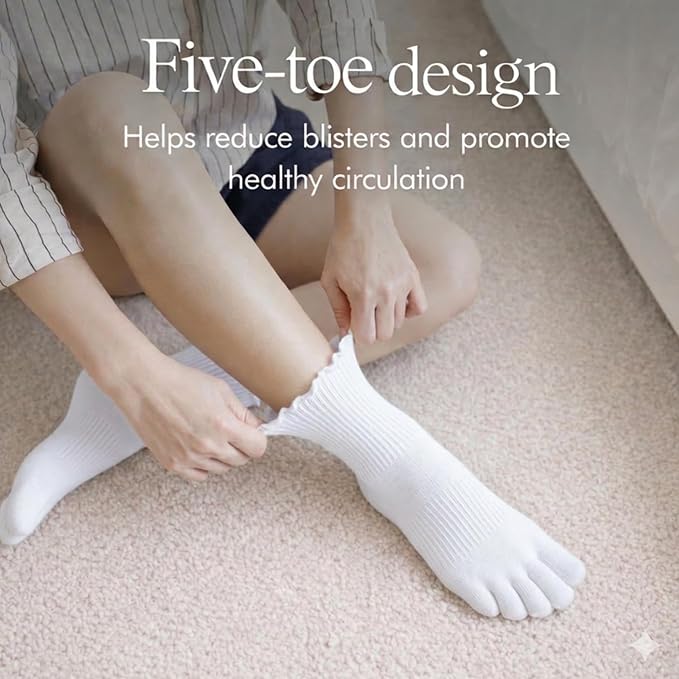 Woman adjusting the ruffle cuff of a white Soxsense five-toe ankle sock