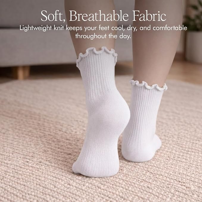 Rear view of white Soxsense ruffle ankle socks worn on a carpet, showing the ribbed cotton knit