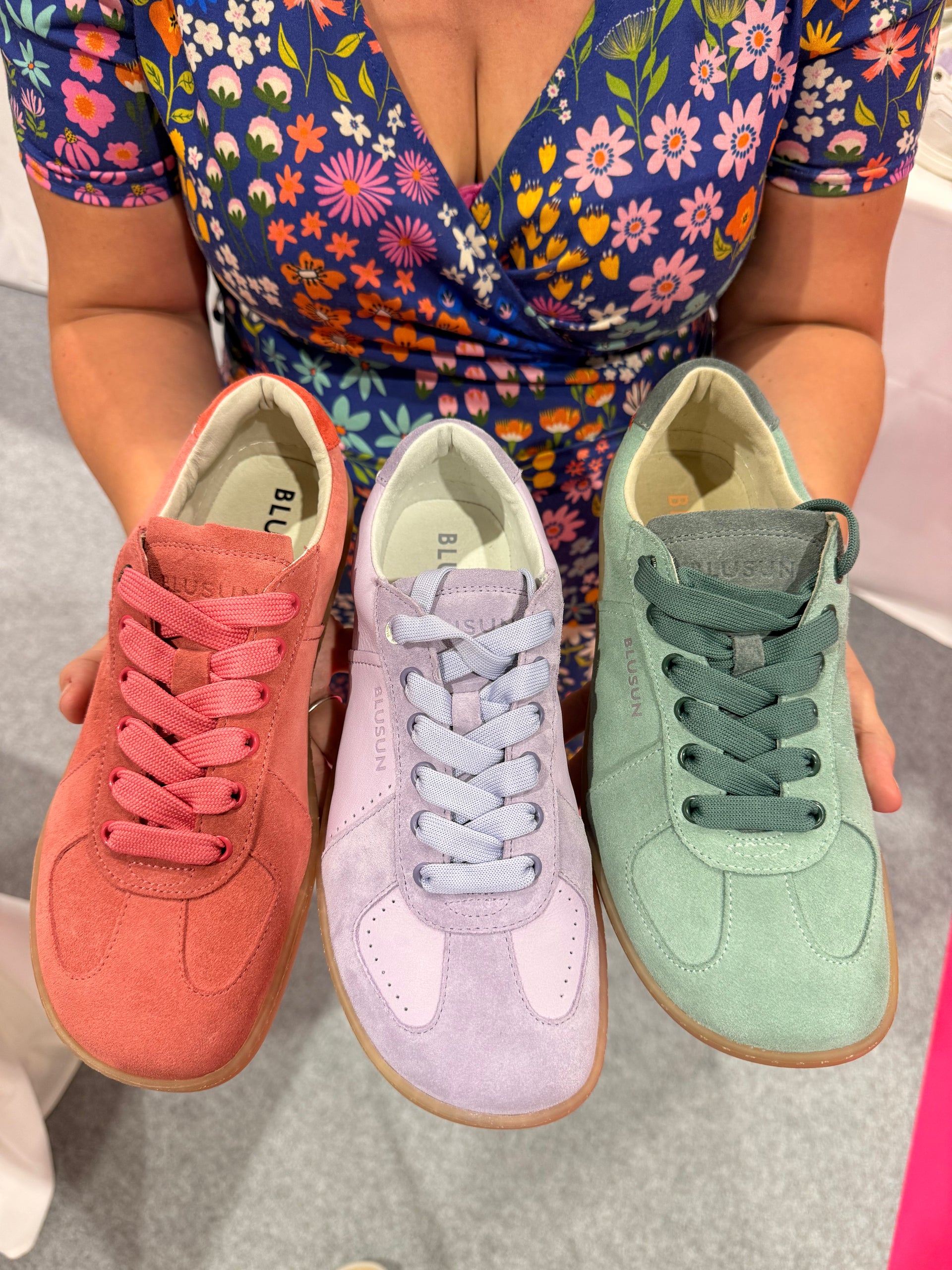 Woman holding pastel Blusun barefoot shoes