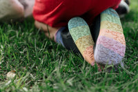 PaperKrane Kranebow JNR kids barefoot Chelsea boots soles standing on grass