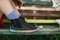 PaperKrane Kranebow JNR barefoot Chelsea boots for kids photographed on a bench