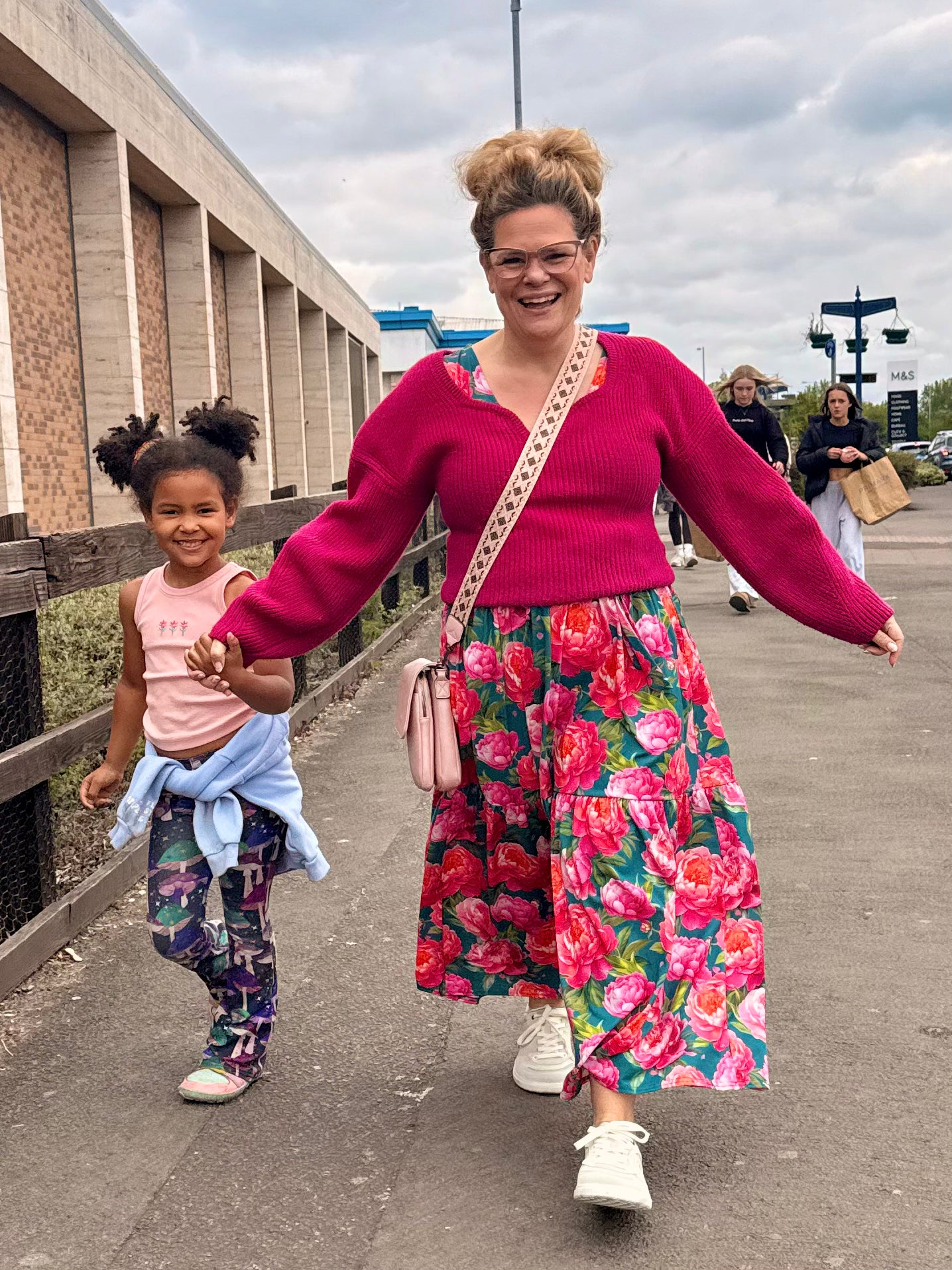 Mother and child walking together in wide fit barefoot shoes for healthy foot development