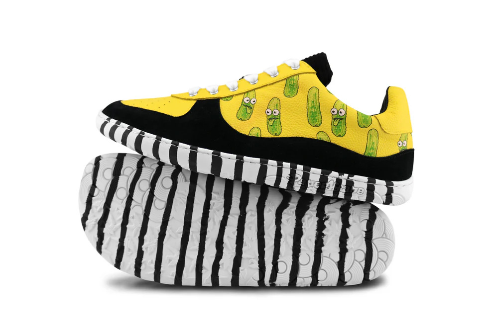 Yellow sneakers with green accents and black and white striped socks on a white background by PaperKrane