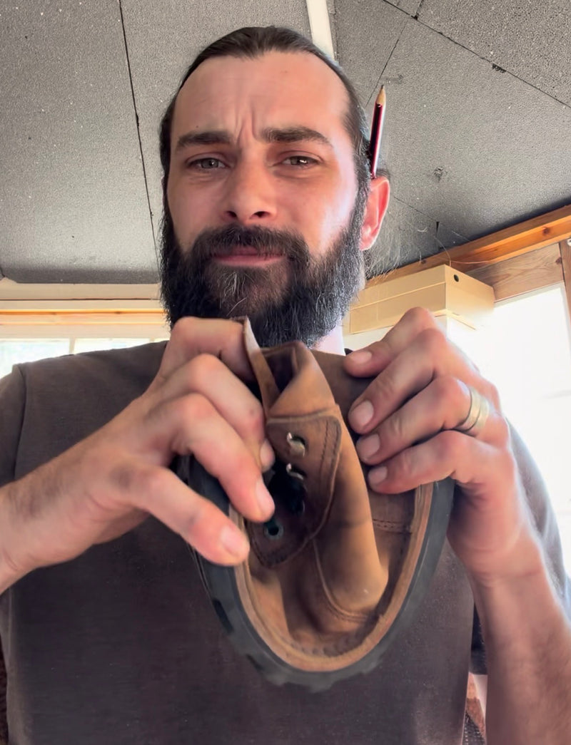 Daniel demonstrating barefoot shoe sole flexibility