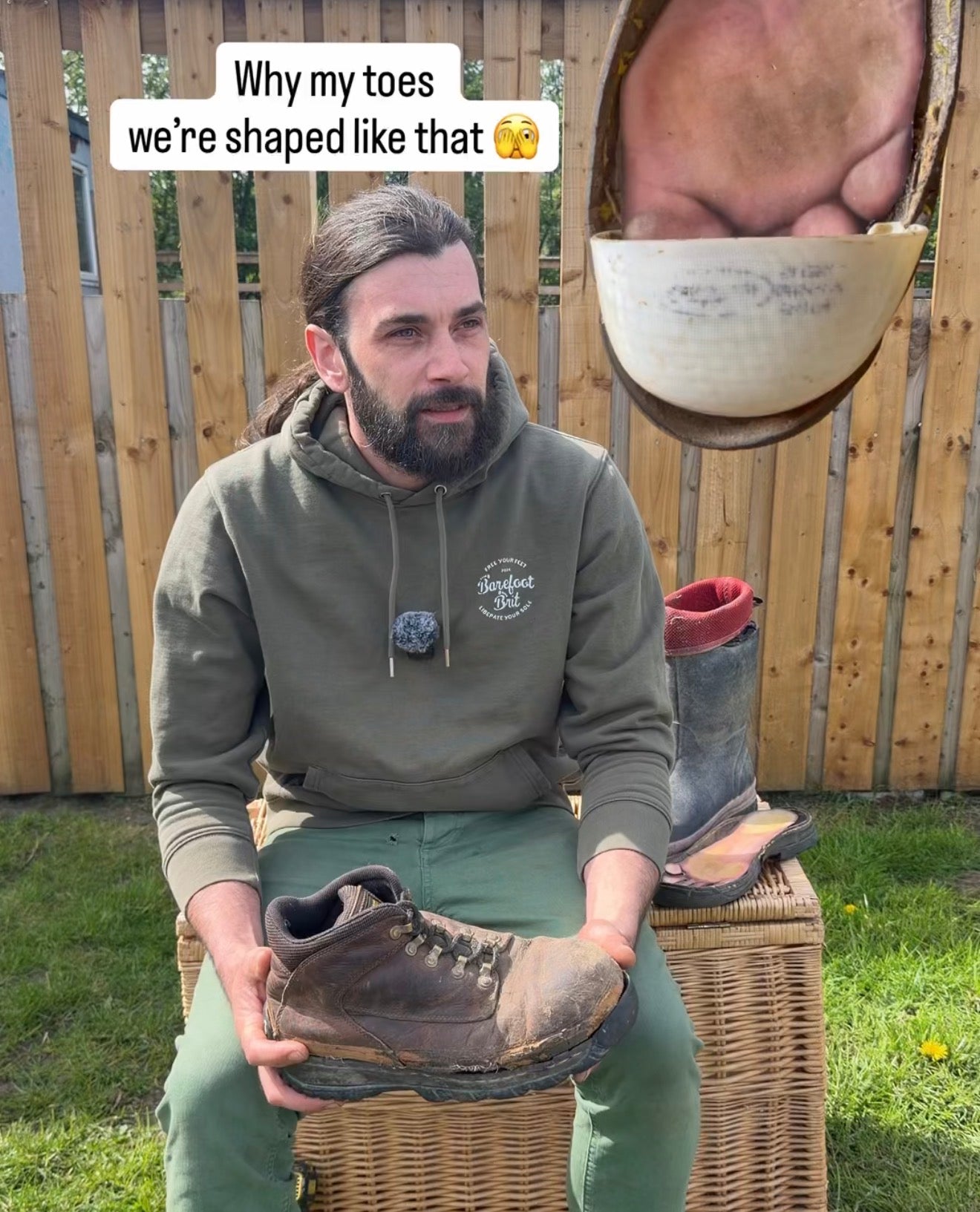 Man holding conventional boots with detached soles showing toe damage from narrow footwear